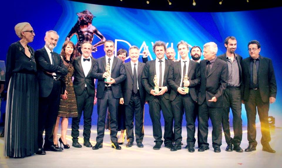 There's Olivia, on the stage of the David Donatello Awards, hiding in the back row.